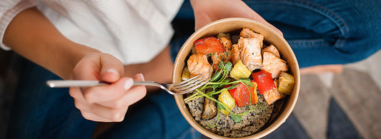 Closeup image of woman eating a healthy meal