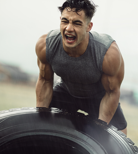 Athlete training with battle ropes